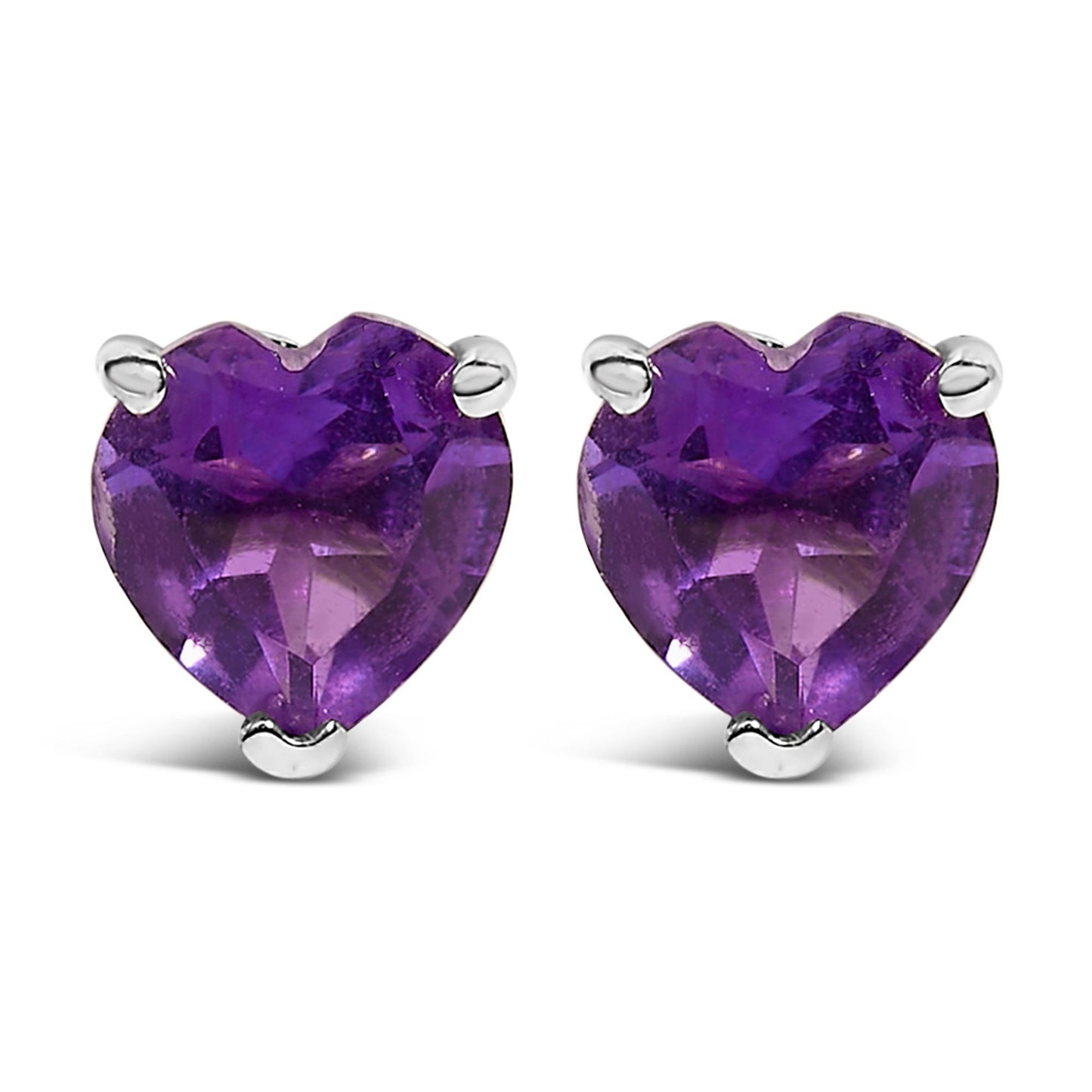 Pair of white metal stud earrings with purple heart-shaped gemstones in a 3-prong setting, shown from a front angle.