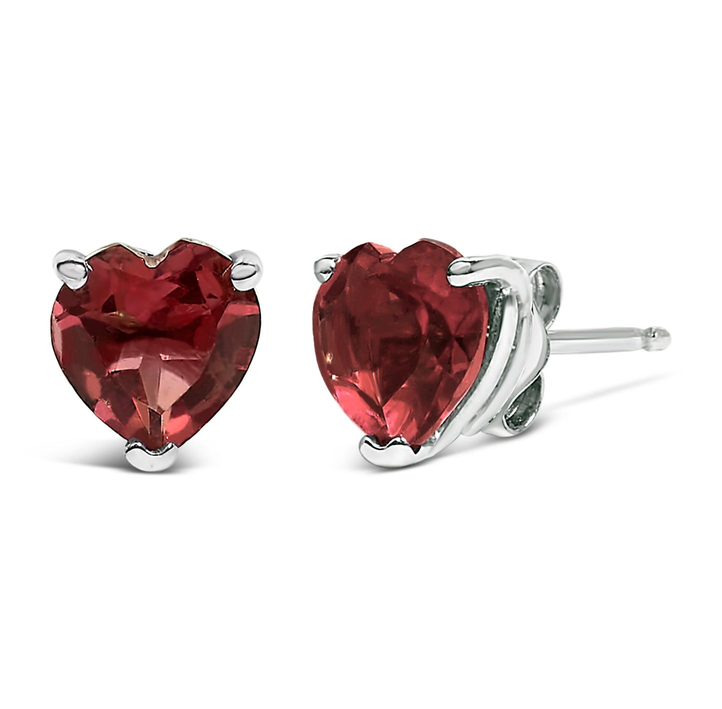 Close-up front and side angle of a pair of white metal stud earrings featuring heart-shaped red gemstones in three-prong settings.