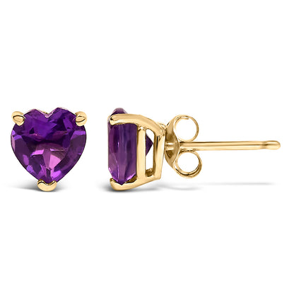 Front and side view of yellow metal stud earrings featuring heart-shaped purple gemstones in 3-prong settings on a white background.