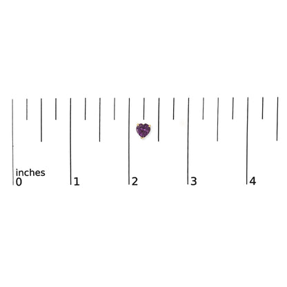 Close-up top view of a yellow metal heart-shaped purple gemstone earring set in a three-prong setting shown on a ruler scale.