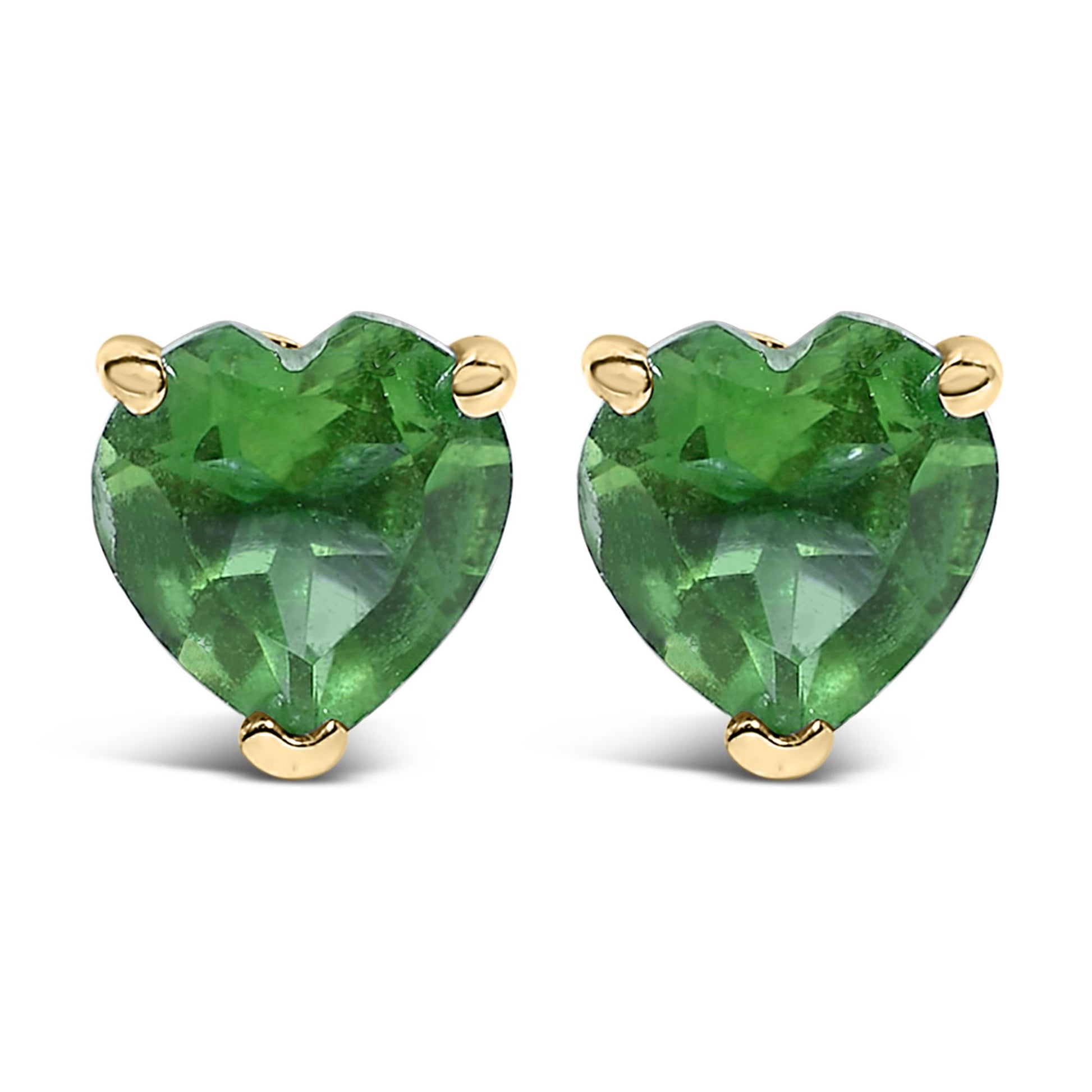 Front view of a pair of yellow metal earrings with heart-shaped green gemstones in three-prong settings.