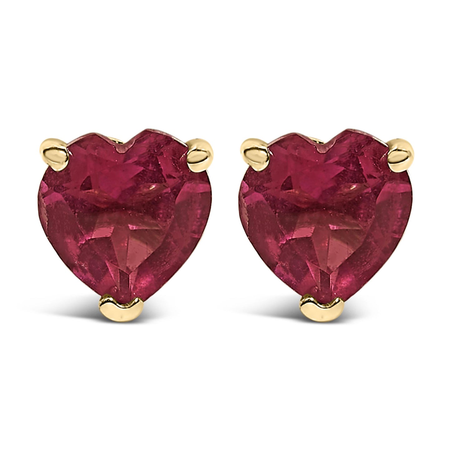 Close-up front view of a pair of yellow metal earrings with heart-shaped red gemstones in a three-prong setting.