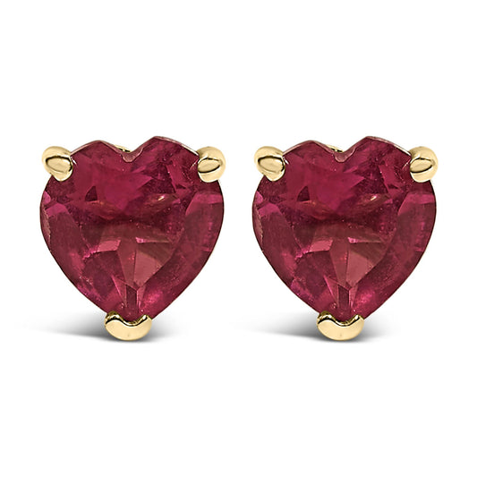 Close-up front view of a pair of yellow metal earrings with heart-shaped red gemstones in a three-prong setting.