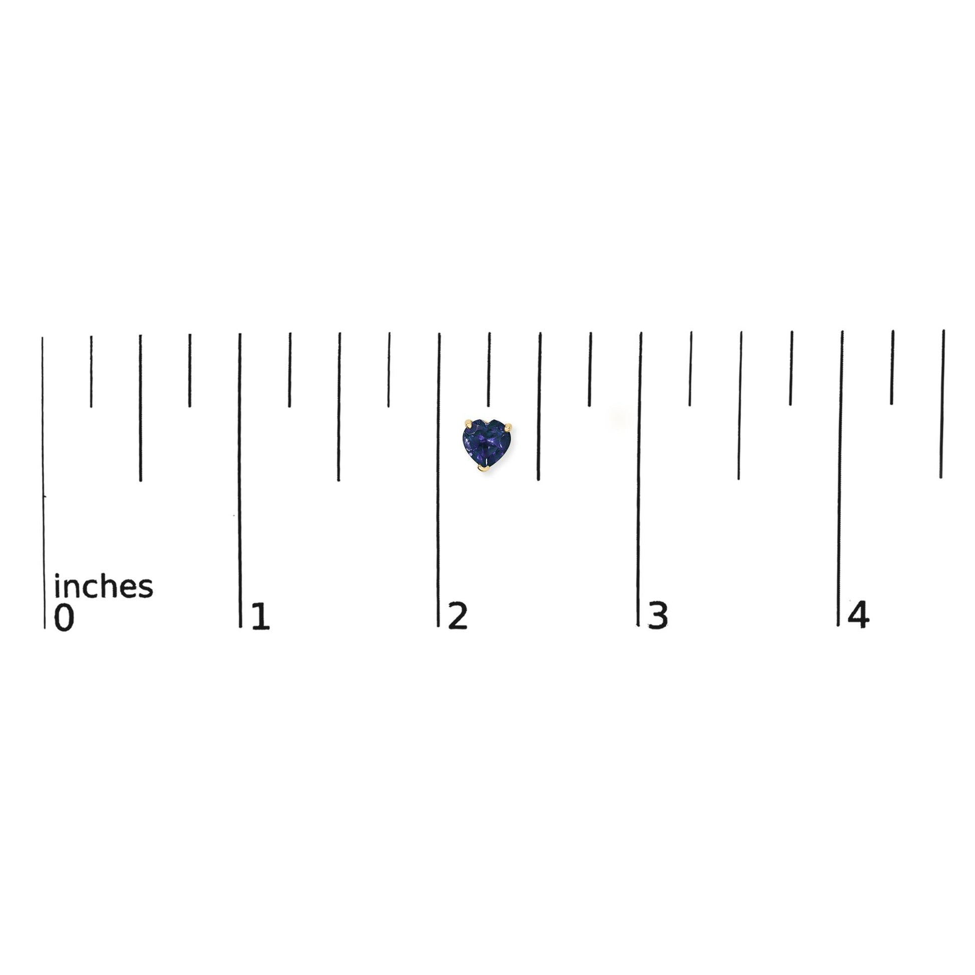 Yellow metal heart-shaped blue gemstone stud earring shown on a ruler scale, front view.