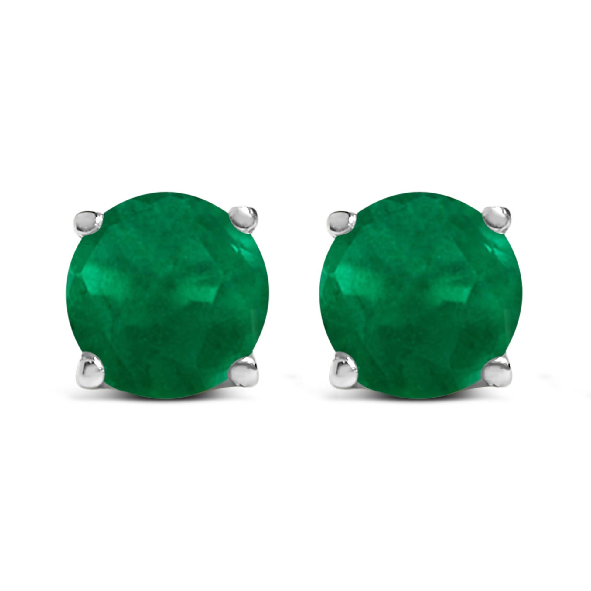 Front view of white metal stud earrings with round green gemstone in four-prong settings.
