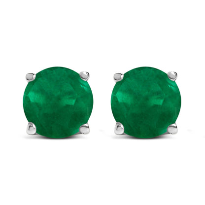 Front view of white metal stud earrings with round green gemstone in four-prong settings.