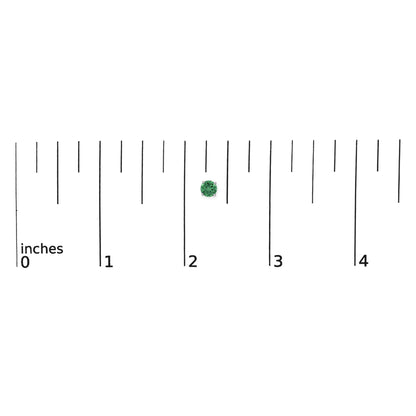 White metal stud earring with a round green gemstone in a 4-prong setting, shown on a scale from a top-down angle.