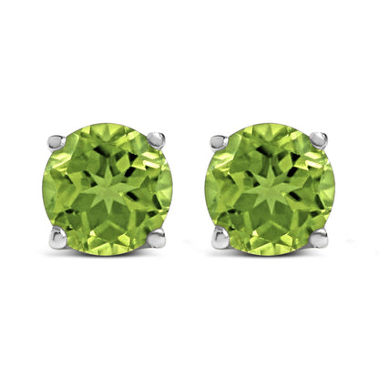 Front view of white stud earrings each featuring a round green gemstone in a four-prong setting.