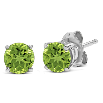 Close-up front and side view of a pair of white metal stud earrings, each featuring a round green gemstone in a four-prong setting.