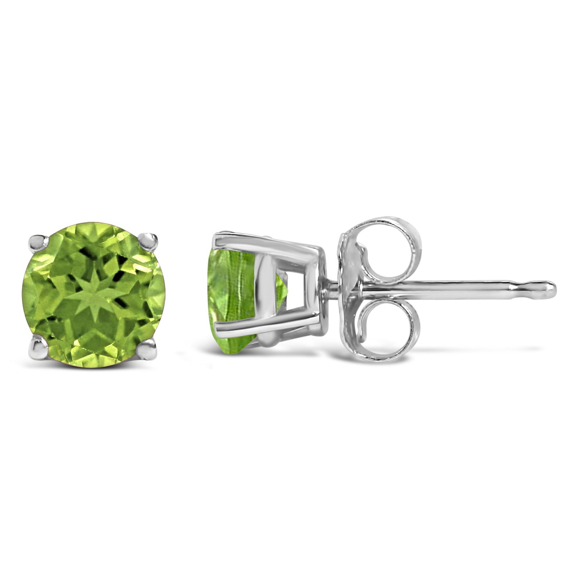Close-up front and side view of a pair of white stud earrings with round green gemstones in four-prong settings shown on a white background.