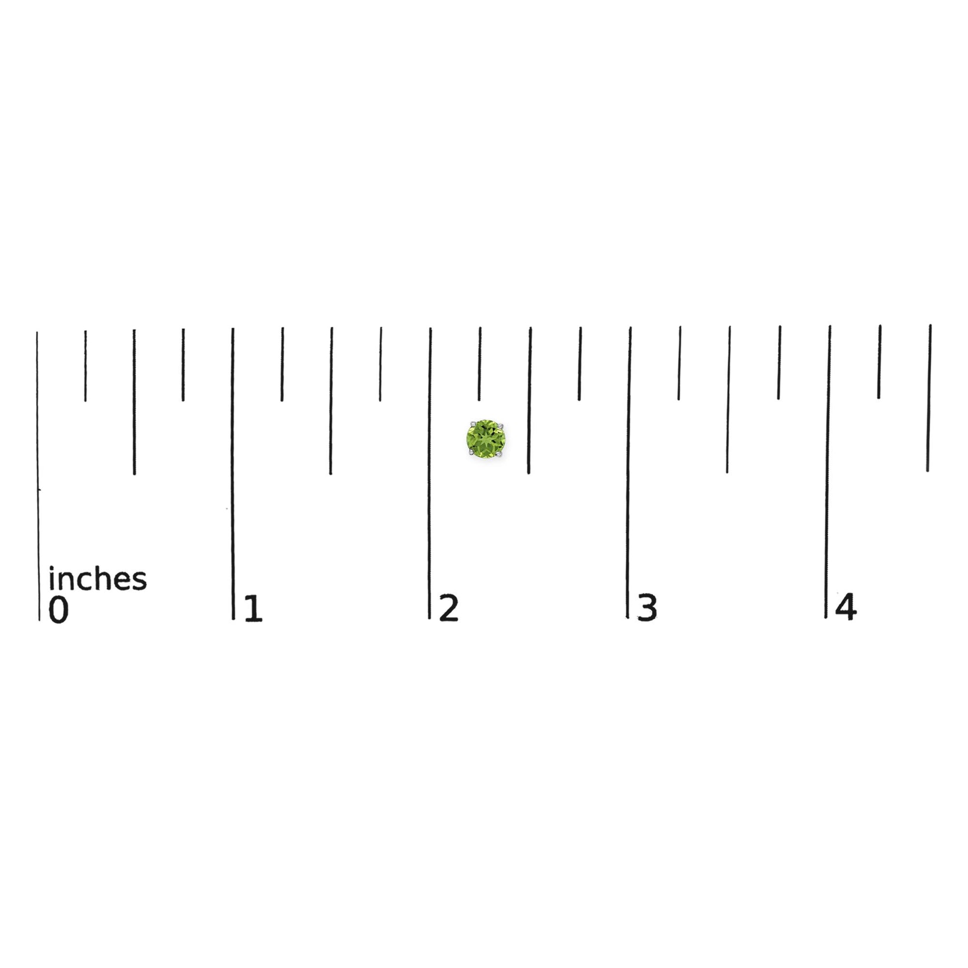 Close-up image of a single round green gemstone earring set with four prongs in white metal, shown on a scale with inch markings.