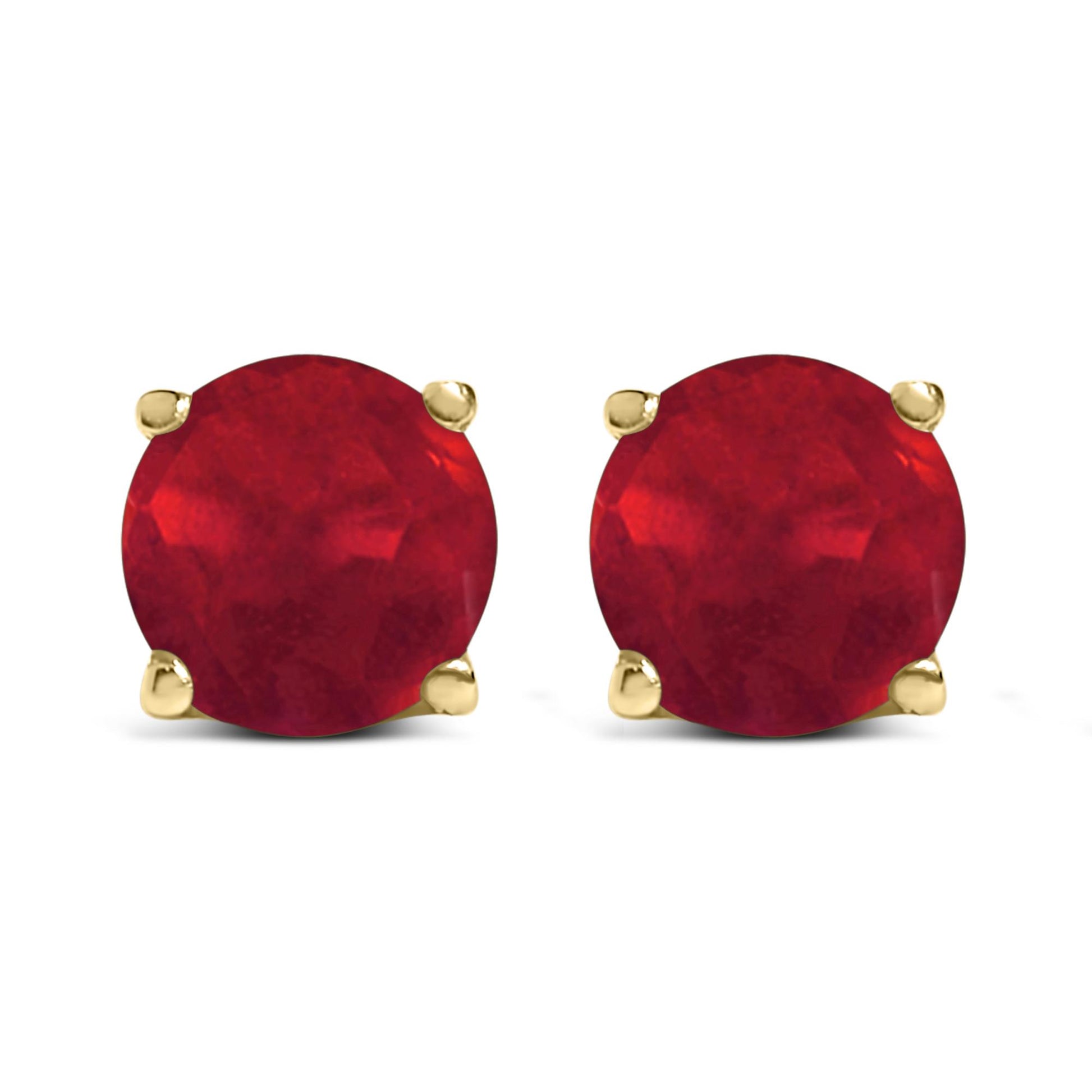 Front view of yellow metal stud earrings featuring round red gemstones in four-prong settings.
