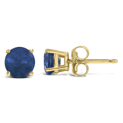 Pair of yellow metal stud earrings with round blue gemstones in four-prong settings, shown from front and side angles on a white background.