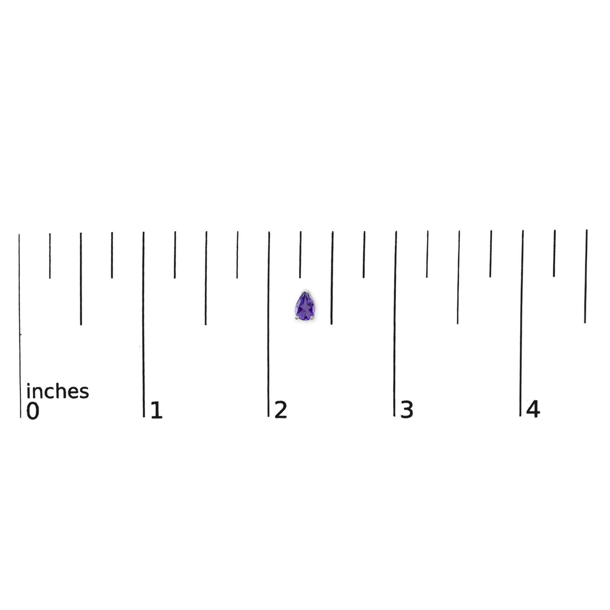 Pear-shaped purple gemstone earring with three-prong white setting shown on a ruler scale, top-down angle.