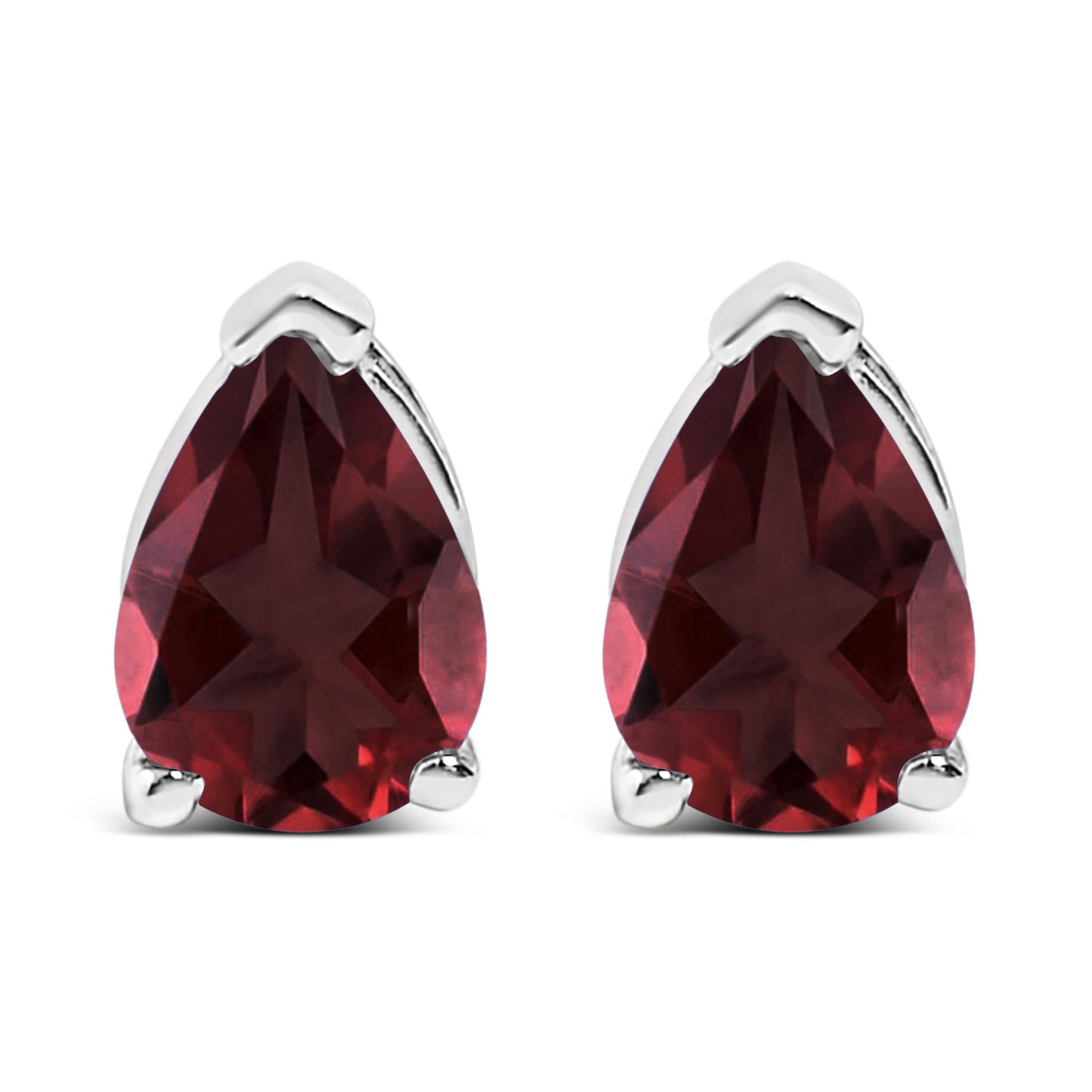 Front view of a pair of white metal earrings featuring pear-shaped red gemstones held by three-prong settings, shown on a white background.