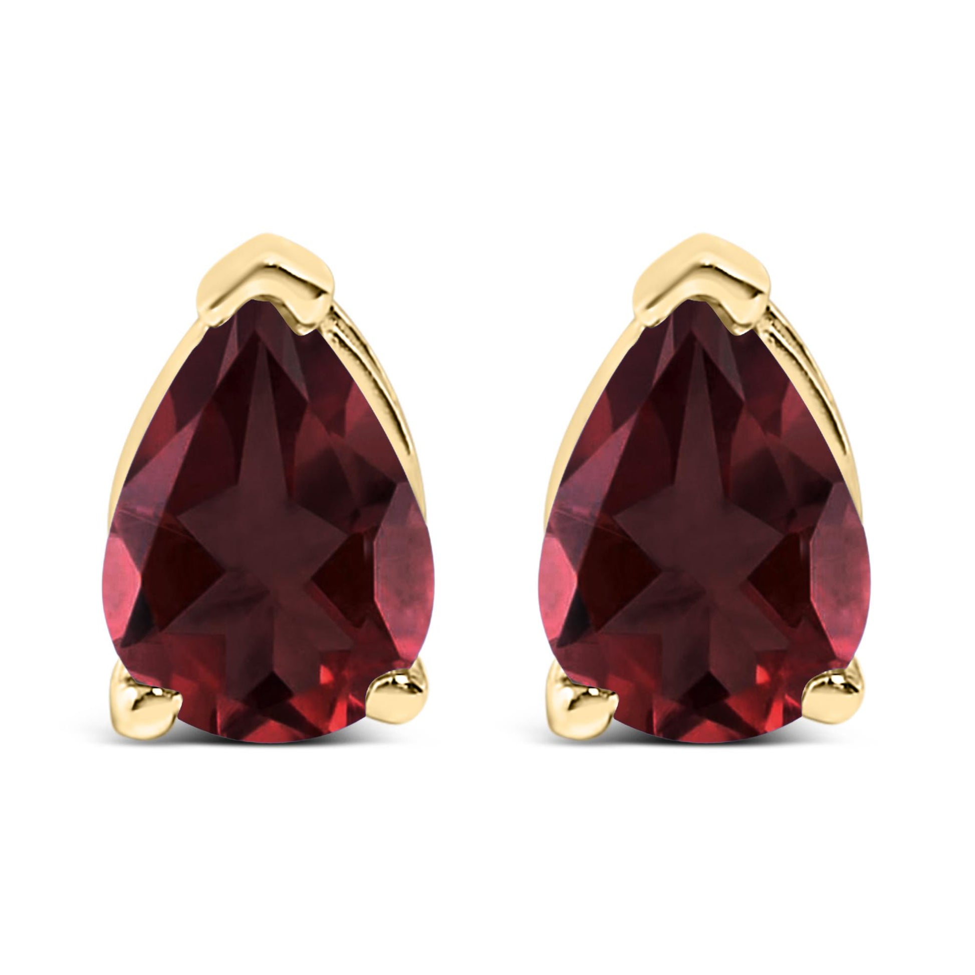 Front view of a pair of yellow metal earrings each featuring a pear-shaped red gemstone in a three-prong setting.