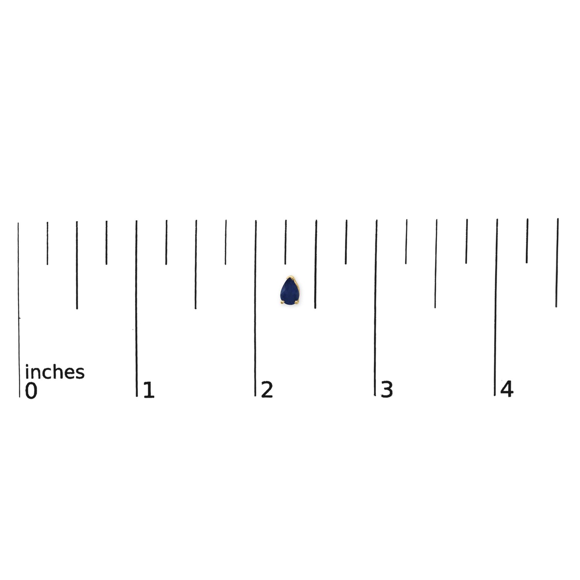 Yellow metal pear-shaped blue gemstone earring shown on a ruler scale from a top front angle.