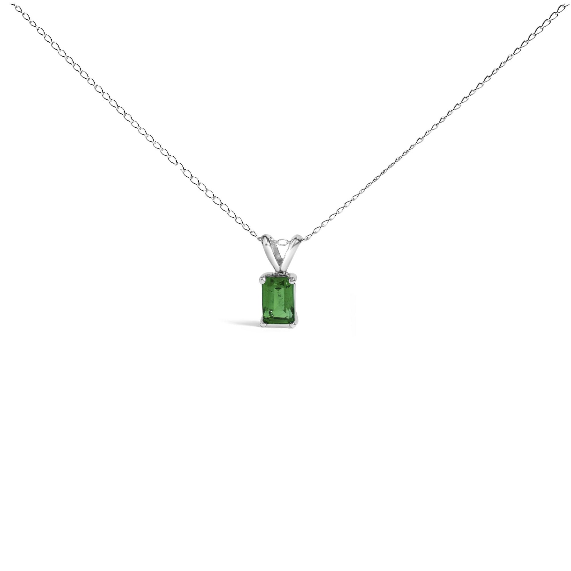 Front view of a white metal necklace with a rectangular green gemstone pendant set in a four-prong setting.