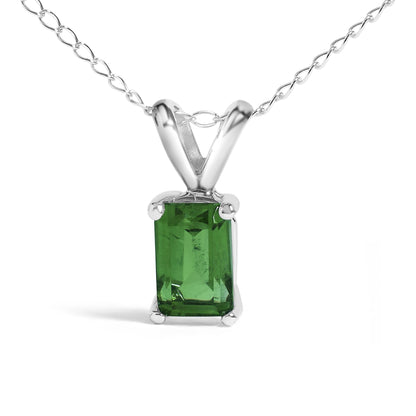 Close-up front view of a white necklace chain featuring a rectangular green gemstone pendant in a four-prong setting.