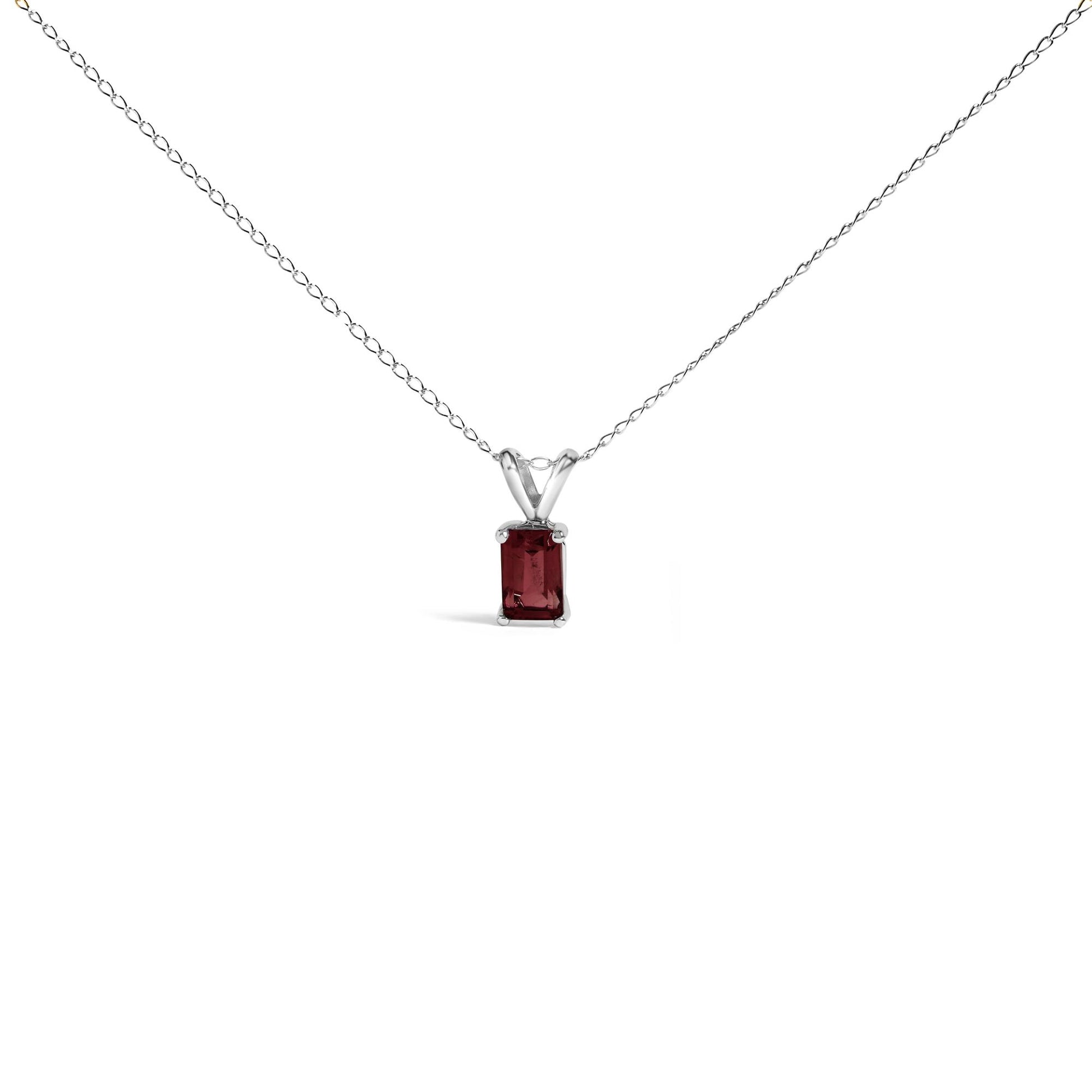 Front view of a white metal necklace with a rectangular red gemstone pendant set in a four-prong setting.