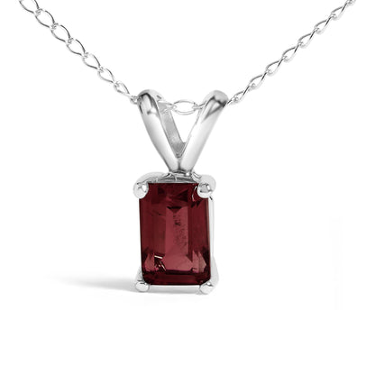 Close-up front view of a white metal necklace with a rectangular red gemstone pendant in a 4-prong setting.