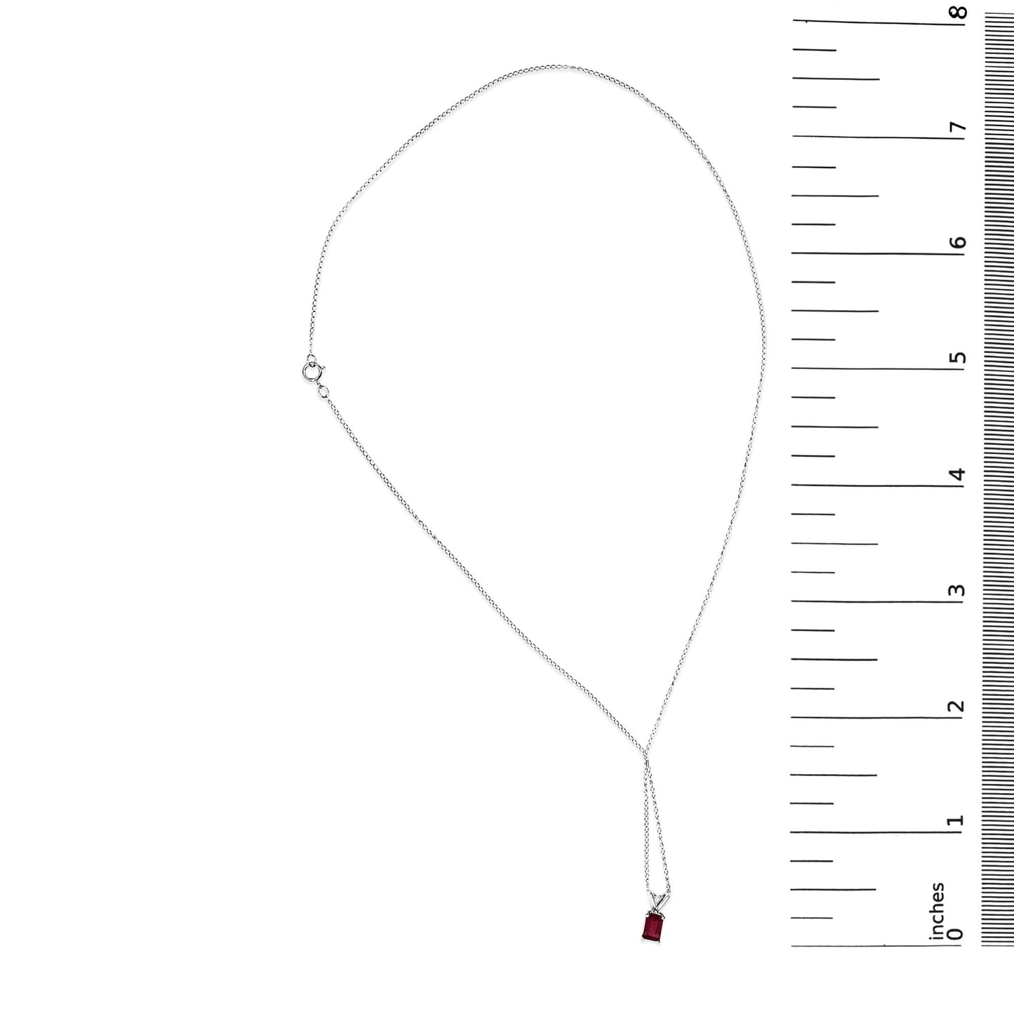 White necklace with a rectangular red gemstone in a 4-prong setting, shown flat with a ruler scale on the right side.
