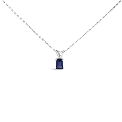 White metal necklace with a rectangular blue gemstone in a 4-prong setting, shown from the front against a white background.