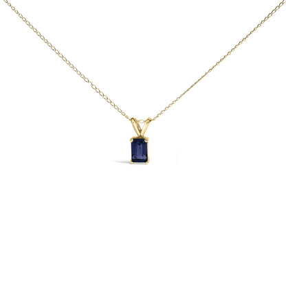 Yellow metal necklace with a rectangular blue gemstone pendant in a four-prong setting, shown in a centered front-facing angle on a white background.