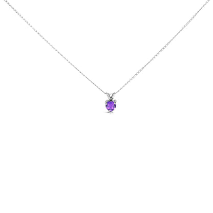 Front view of a white necklace with a heart-shaped purple gemstone pendant in a three-prong setting.