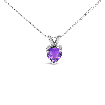 Close-up front view of a white necklace with a heart-shaped purple gemstone pendant in a three-prong setting.