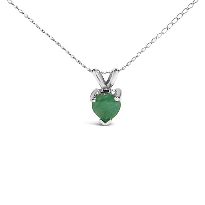 Front view of a white necklace with a heart-shaped green gemstone pendant in a three-prong setting on a chain.