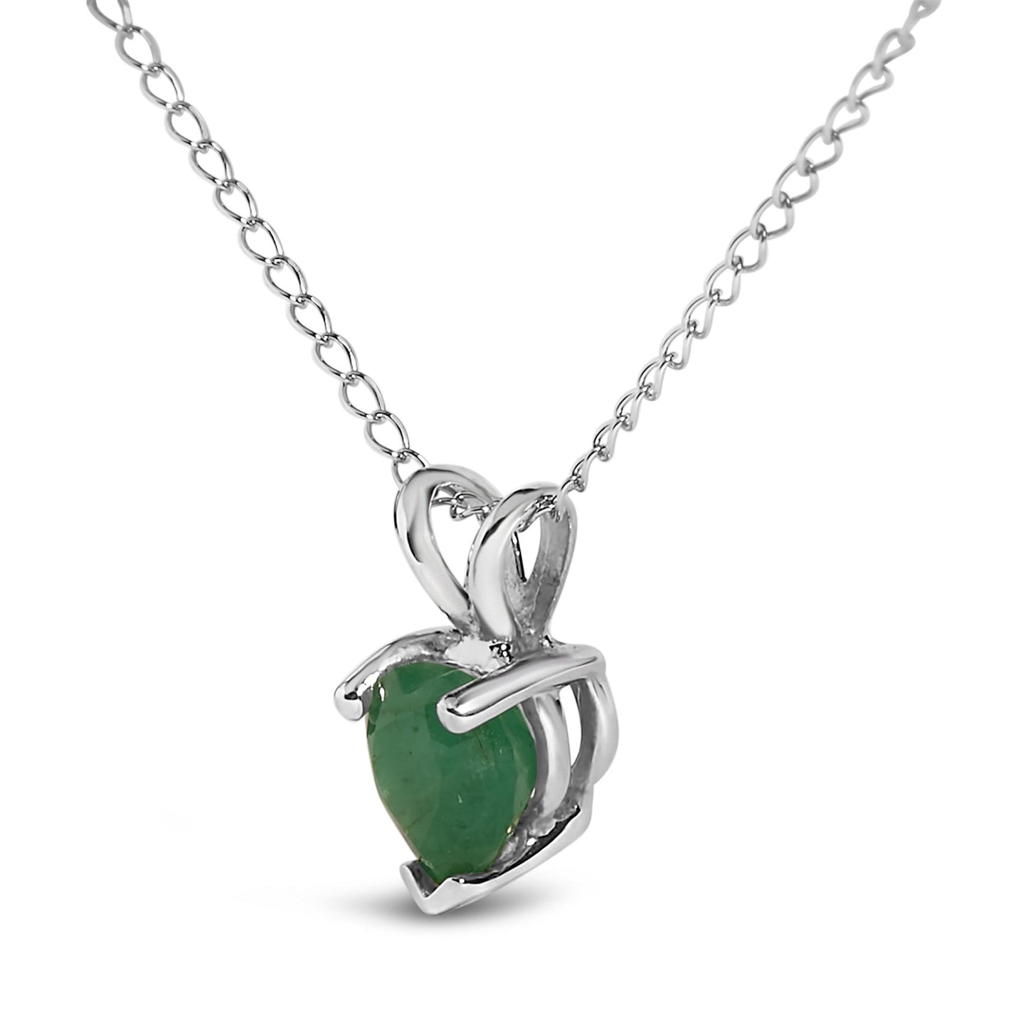 Close-up front angle of a white metal necklace featuring a heart-shaped green gemstone pendant in a three-prong setting.