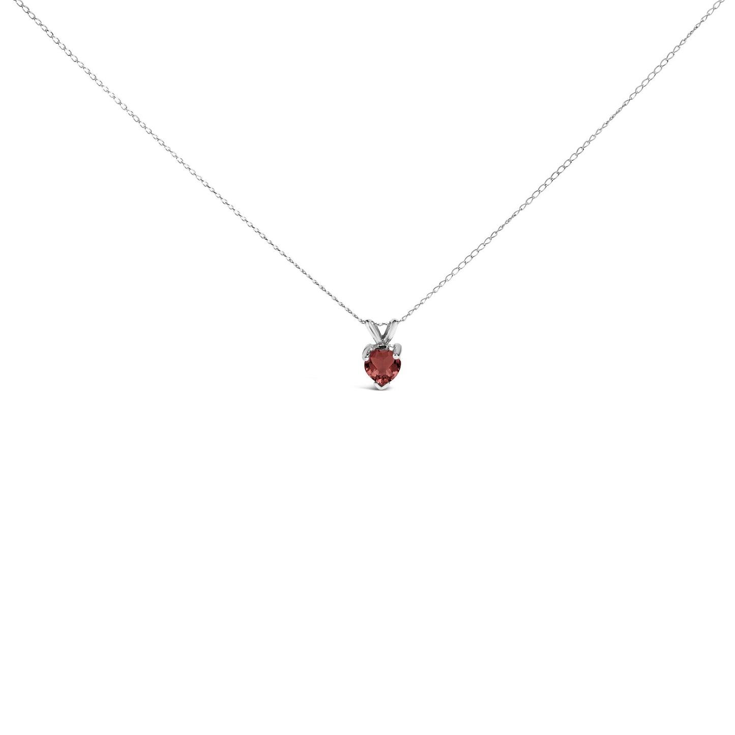 Close-up front view of a white metal necklace with a heart-shaped red gemstone pendant in a three-prong setting.