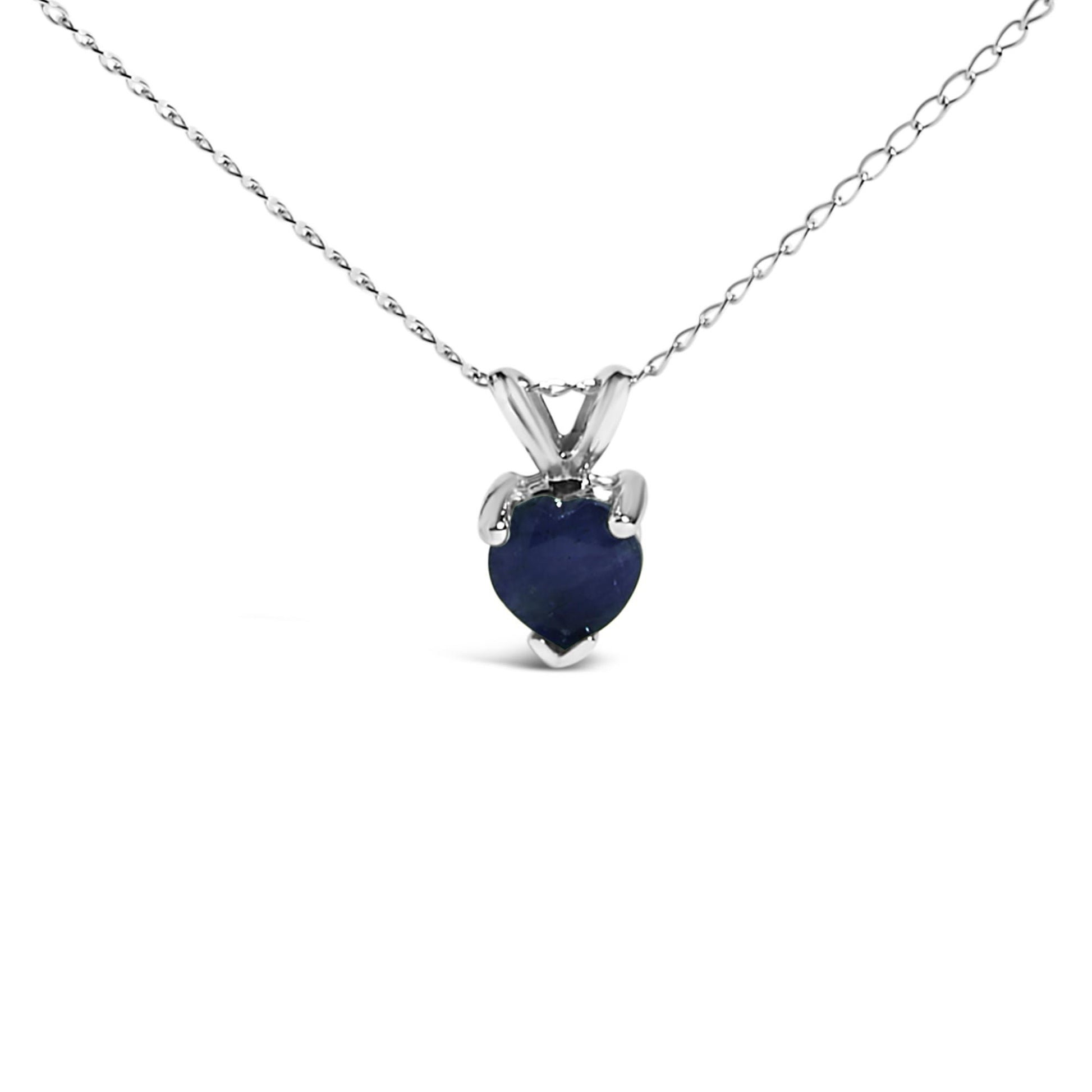 Front view of a white necklace with a heart-shaped blue gemstone pendant in a three-prong setting.