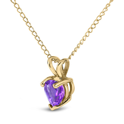 Yellow metal necklace with a heart-shaped purple gemstone pendant, shown in a close-up angled front view.