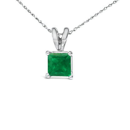 Close-up front view of a white necklace featuring a princess-shaped green gemstone held by a four-prong setting.
