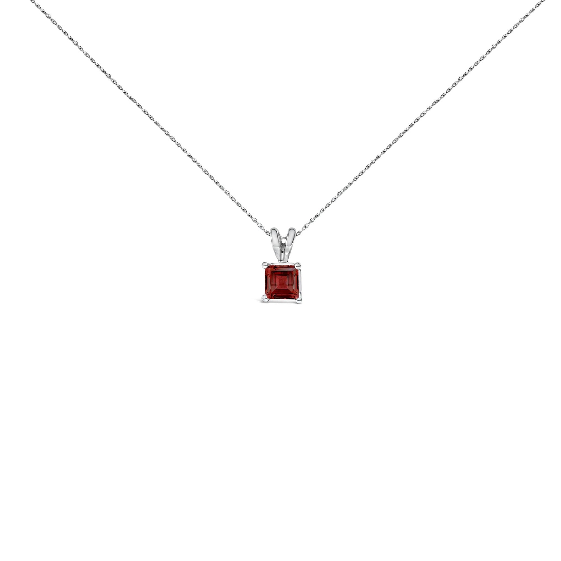 Front-facing shot of a white necklace featuring a single princess-cut red gemstone in a four-prong setting.