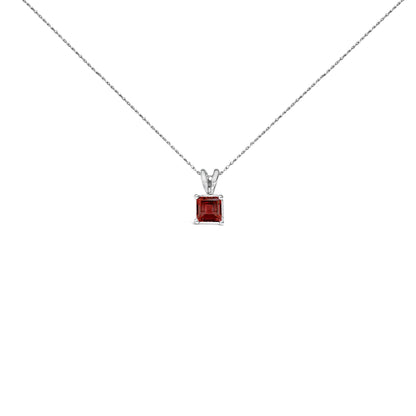 Front-facing shot of a white necklace featuring a single princess-cut red gemstone in a four-prong setting.