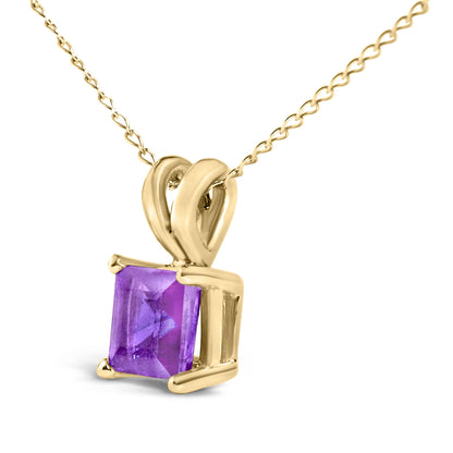 Close-up angled view of a yellow metal necklace with a square purple gemstone set in a four-prong setting, shown against a white background.