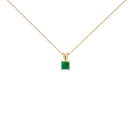 Front view of a yellow necklace with a square green gemstone pendant in a four-prong setting.