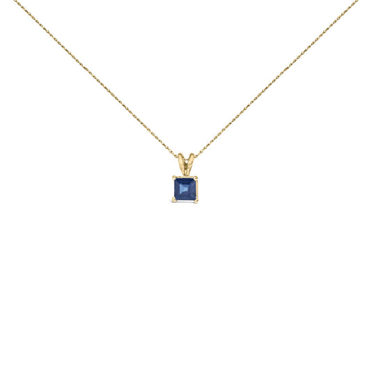 Front view of yellow metal necklace with a single blue princess-shaped gemstone pendant in a four-prong setting.