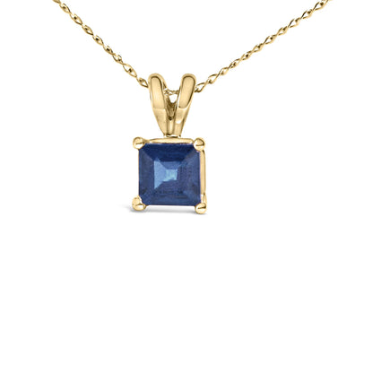 Yellow necklace with a princess-shaped blue gemstone pendant in a four-prong setting, shown in a front close-up view.