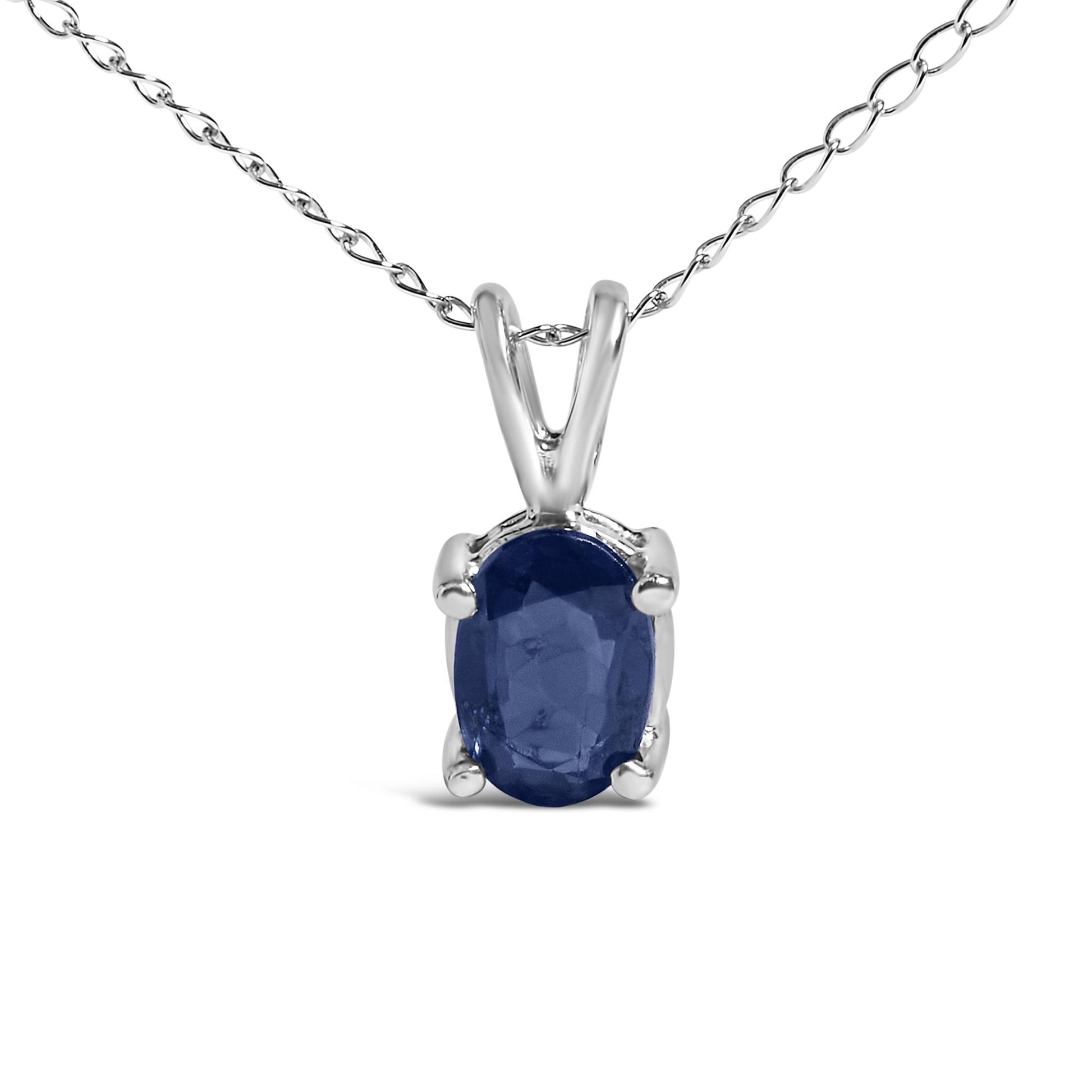 Close-up front view of a white metal necklace featuring an oval-shaped blue gemstone in a four-prong setting.
