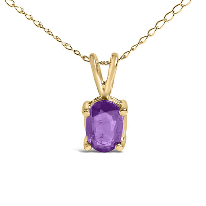 Close-up front view of a yellow necklace with an oval purple gemstone in a four-prong setting.