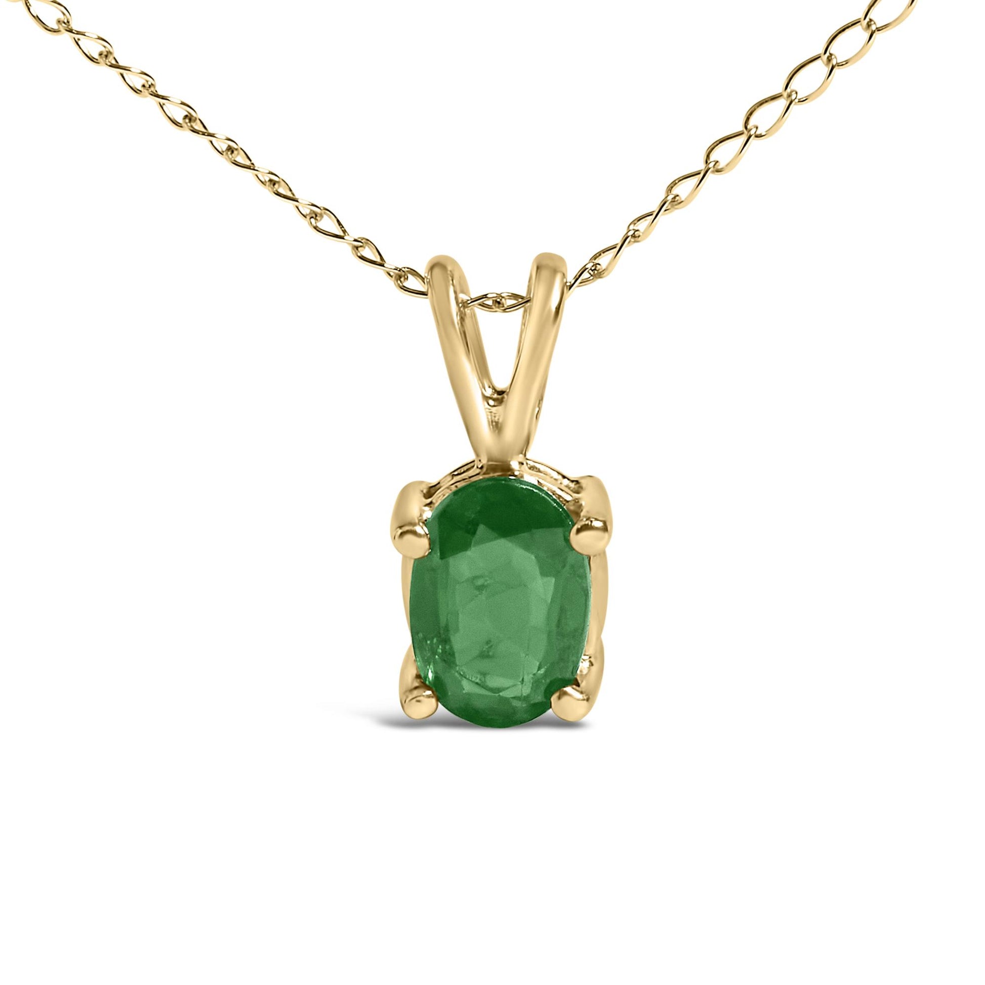 Close-up front view of a yellow necklace with an oval green gemstone pendant in a four-prong setting.