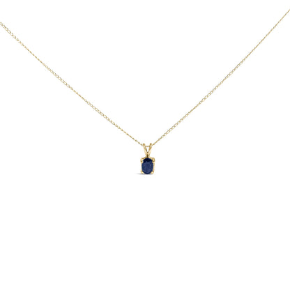 Front view of a yellow necklace with a small oval blue gemstone pendant shown on a white background.