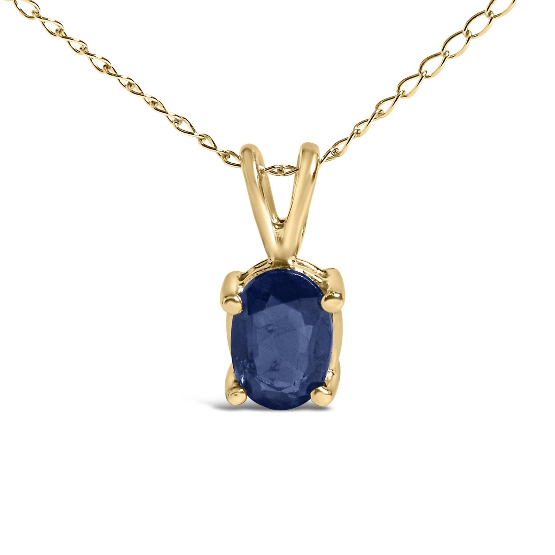 Close-up front view of a yellow metal necklace featuring an oval blue gemstone pendant in a four-prong setting.