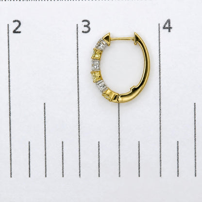 Close-up image of a yellow and white metal hoop earring shown on a scale, front angle, featuring alternating cushion-shaped yellow gemstones and round-shaped white gemstones in prong settings along the front half.