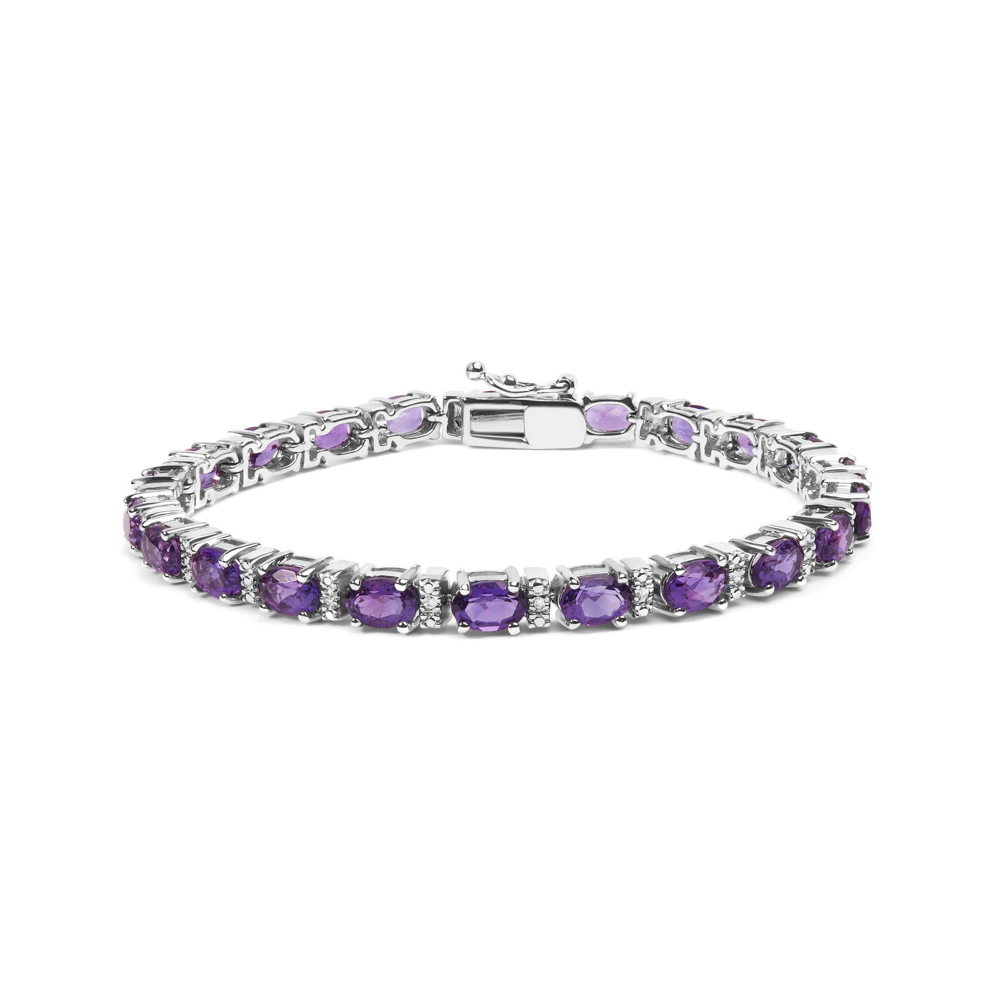 White metal bracelet with oval purple gemstones and round white gemstones in shared prong setting, displayed in a front angled view.