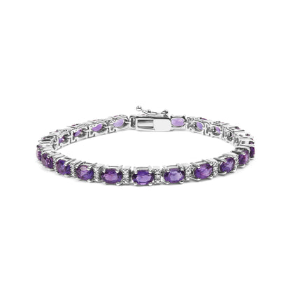 White metal bracelet with oval purple gemstones and round white gemstones in shared prong setting, displayed in a front angled view.